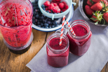 Dieting and well being concept, berry smoothie in jar