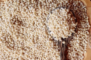 raw the barley on wood background.