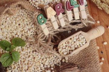 raw the barley on wood background.