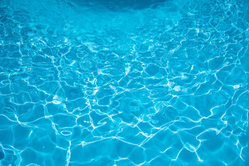 Fototapeta na wymiar Water surface in swimming pool