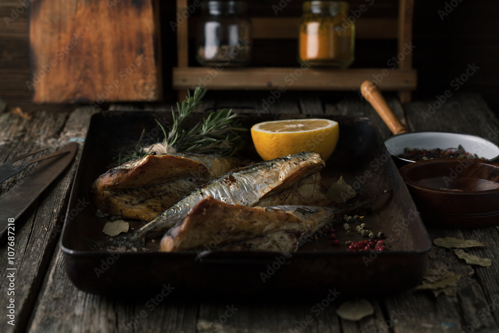 Canvas Prints Grilled mackerel with herbs and spices in a pan