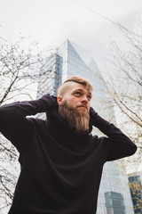 Stylish bearded man posing in the street