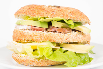 Sandwich with cheese, avocado, sirloin and lettuce