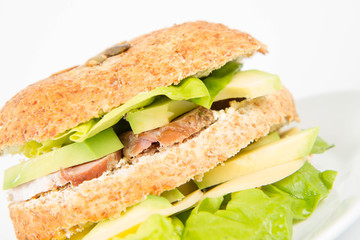 Sandwich with cheese, avocado, sirloin and lettuce