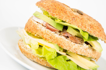 Sandwich with cheese, avocado, sirloin and lettuce