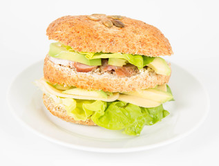 Sandwich with cheese, avocado, sirloin and lettuce