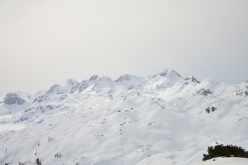 Fototapeta na wymiar Winter snow covered mountain peaks in Europe