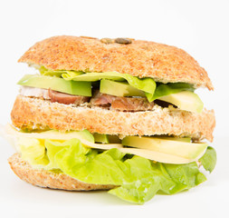 Sandwich with cheese, avocado, sirloin and lettuce