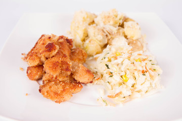 Deep fried chicken, potatoes and salad