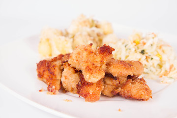 Deep fried chicken, potatoes and salad