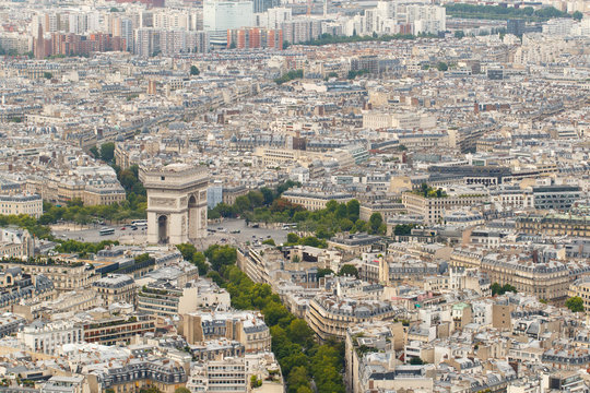 Color DSLR wide angle stock skyline of Paris, France, with the Arc de Triomphe. Urban scene shot from above on top of Eiffel Tower. Horizontal with copy space for text.