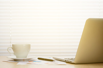 Office workplace with with laptop and coffee