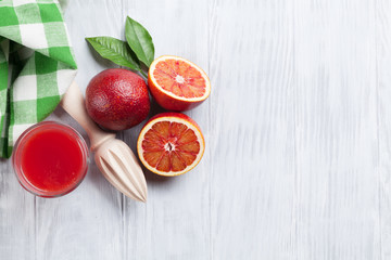 Fresh ripe red oranges and juice