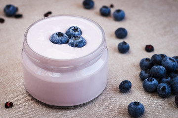 Healthy breakfast - blueberry yogurt with berries on a napkin