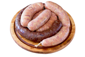 Homemade liver sausage meat and raw sausage on a wooden board
