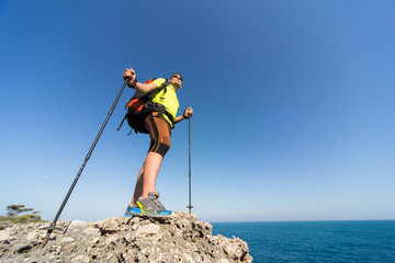 Hiking in the national park along the sea in the summer.