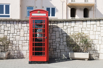 Phone booth. Typical British telephone booth at the street.