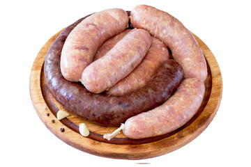 Homemade liver sausage meat and raw sausage on a wooden board