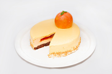 Apricot cake with a fruit on white plate