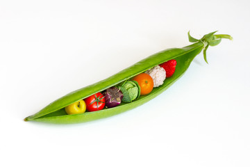 A pea pod containing fruits and vegetables 