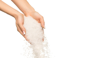 Sea salt crystals in women hand