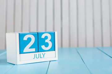 July 23rd. Image of july 23 wooden color calendar on white background. Summer day. Empty space for text. National Hot Dog Day. World Whale and Dolphin DAY