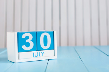 July 30th. Image of july 30 wooden color calendar on white background. Summer day. Empty space for text