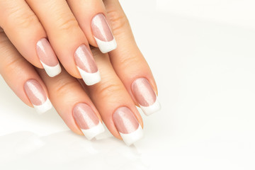 Woman hands with french manicure  close-up