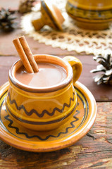 Hot chocolate with cinnamon in a rustic ware