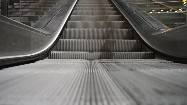 Escalator running up at the train station in Berlin, Germany