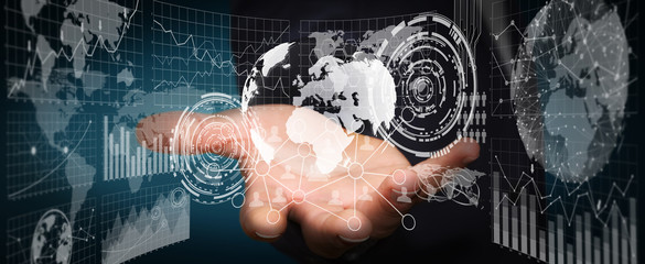 Businessman holding digital charts and globe
