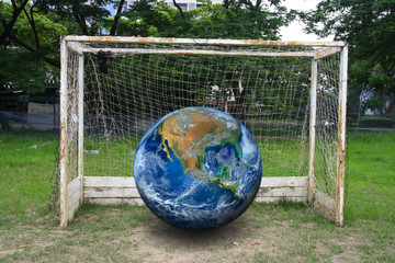 the earth on soccer goal, including elements furnished by NASA. - 107703056