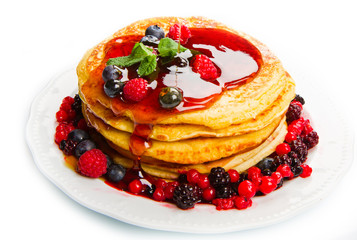 deliciuos pancake with fresh fruit on white