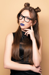 Beautiful young woman in glasses