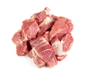 raw pork neck meat cut in pieces isolated on white