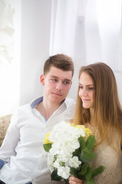 Nice young couple sitting on the sofa