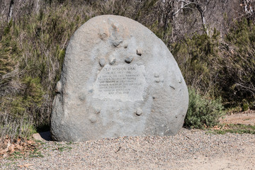 Stone marker for the Old Mission Dam in Mission Trails Regional Park in San Diego, California. 