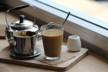 coffee dripping in vietnamese style on wooden table