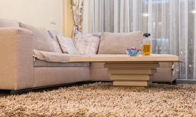 Low angle view of coffee table and white sofa