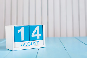 August 14th. Image of august 14 wooden color calendar on blue background. Summer day. Empty space for text