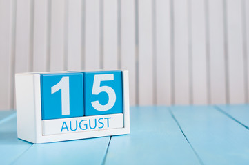 August 15th. Image of august 15 wooden color calendar on blue background. Summer day. Empty space...
