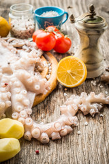 Whole raw octopus with lemon and vegetables