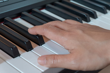 Fototapeta premium Hand playing piano