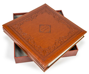 Fototapeta premium Brown leather photo album cover with decorative frame 