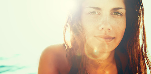 Face of young woman in summer sun