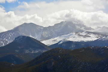 Snow Covered Mountains with Billowing White Clouds