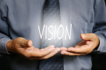 Vision word on hand, businessman