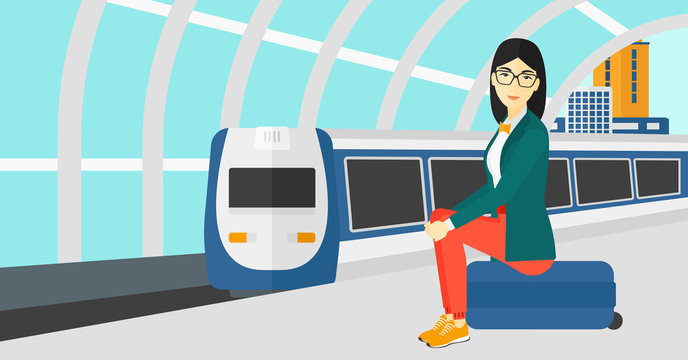 Woman sitting on railway platform.