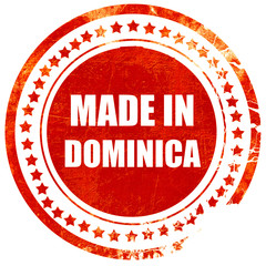 Made in dominica, grunge red rubber stamp on a solid white backg