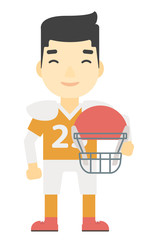 Rugby player with ball and helmet in hands.